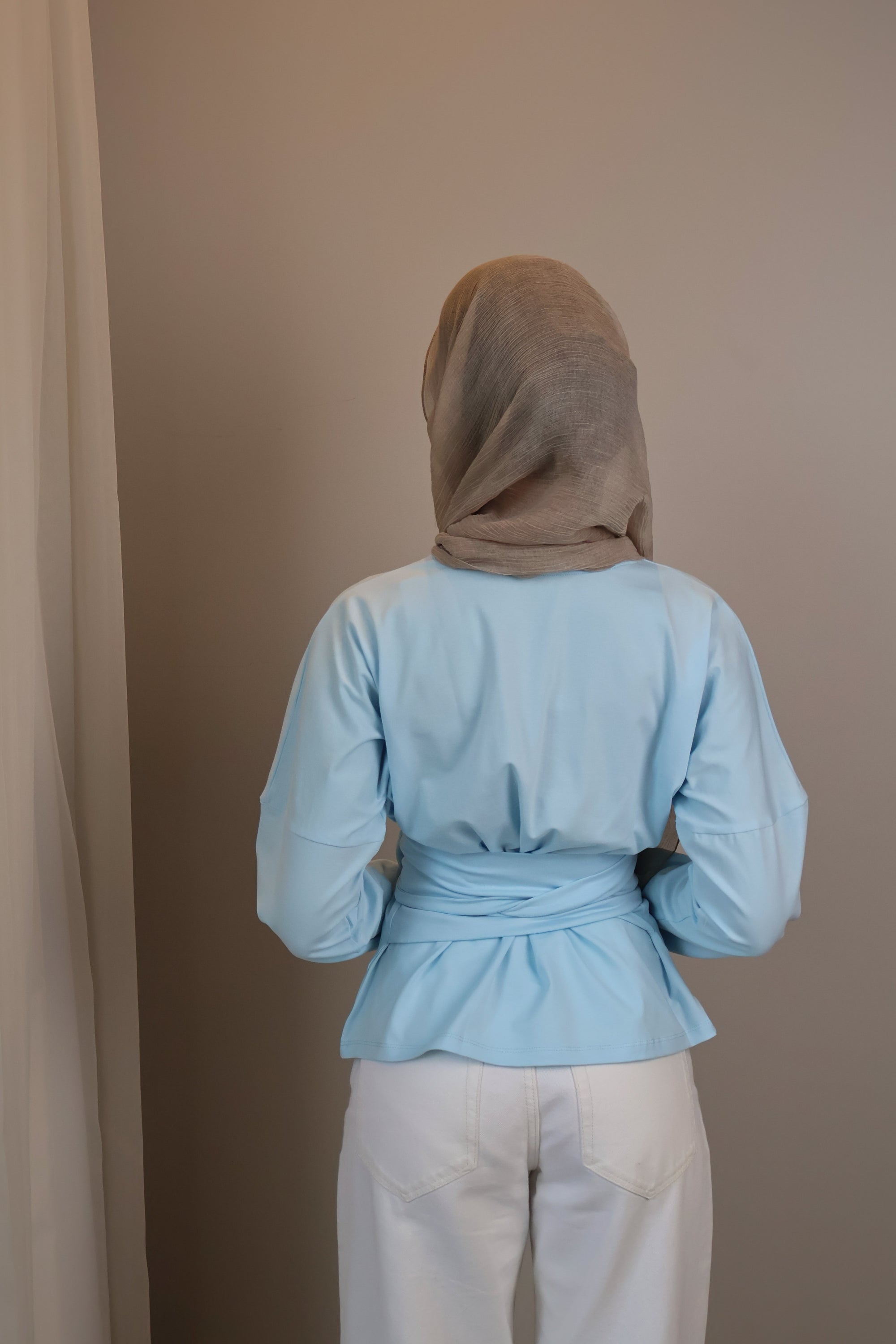 Belted long sleeve crewneck
